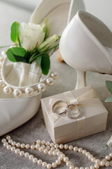 Wedding day. Bouquets and various wedding accessories, shoes, invitations, rings in the morning at the bride's preparation