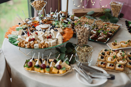 Wedding day. Buffet table with various types of snacks and sweets in the celebration hall