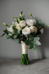 Wedding day. Bouquets and various wedding accessories, shoes, invitations, rings in the morning at the bride's preparation