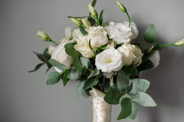 Wedding day. Bouquets and various wedding accessories, shoes, invitations, rings in the morning at the bride's preparation