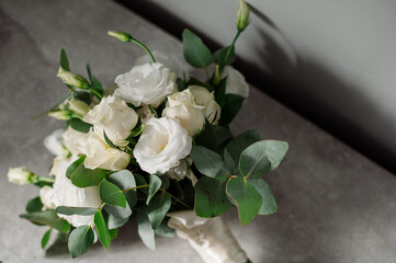 Wedding day. Bouquets and various wedding accessories, shoes, invitations, rings in the morning at the bride's preparation