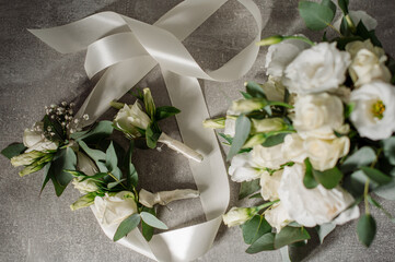 Wedding day. Bouquets and various wedding accessories, shoes, invitations, rings in the morning at the bride's preparation