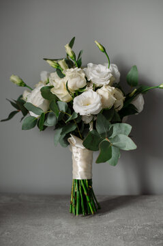 Wedding day. Bouquets and various wedding accessories, shoes, invitations, rings in the morning at the bride's preparation