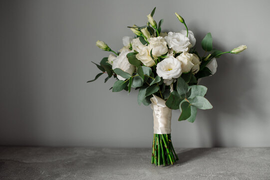 Wedding day. Bouquets and various wedding accessories, shoes, invitations, rings in the morning at the bride's preparation