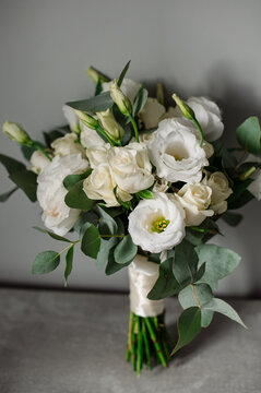 Wedding day. Bouquets and various wedding accessories, shoes, invitations, rings in the morning at the bride's preparation