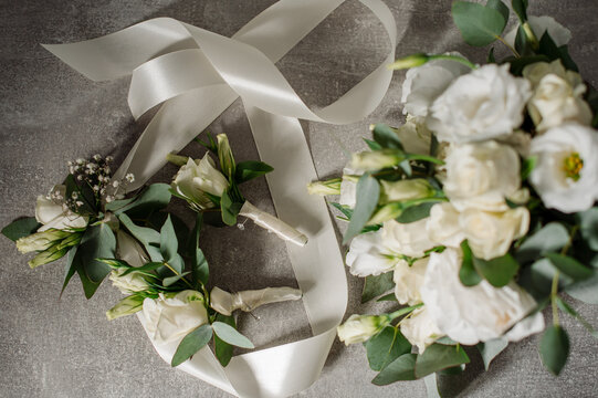 Wedding day. Bouquets and various wedding accessories, shoes, invitations, rings in the morning at the bride's preparation