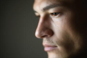 Fototapeta premium dynamic portrait of boxer with thoughtful expression positioned on left side of frame