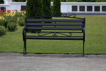 Wooden benches and chaise lounges for rest on the streets of the city and in the park, public places