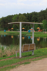 Benches for relaxing on the embankment near the lake, public places