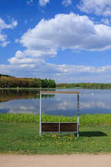 Benches for relaxing on the embankment near the lake, public places