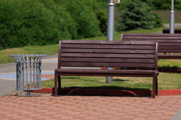Wooden benches and chaise lounges for rest on the streets of the city and in the park, public places
