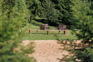 Wooden benches and chaise lounges for rest on the streets of the city and in the park, public places