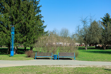 Wooden benches and chaise lounges for rest on the streets of the city and in the park, public places