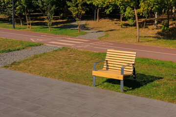 Wooden benches and chaise lounges for rest on the streets of the city and in the park, public places