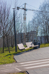 Wooden benches and chaise lounges for rest on the streets of the city and in the park, public places