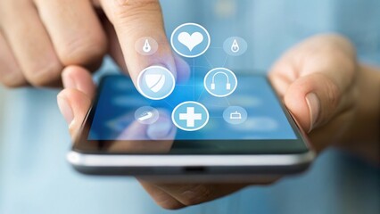 A hand interacts with a smartphone displaying health-related icons, symbolizing the integration of technology and wellness.