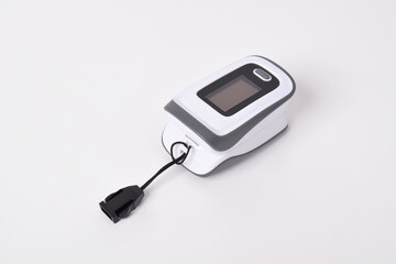 Pulse oximeter device to measure pulse rate and oxygen levels isolated on white background....