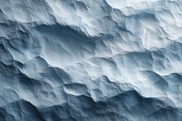 Obraz premium Artistically crumpled handcrafted paper in light blue color, soft material. Handmade paper with unique texture and visible fibers, made from recycled paper, plants. Eco-friendly organic surface