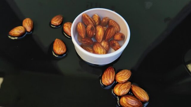 cup full of almonds , soaking almonds , pull out shot ,  , anti aging concept