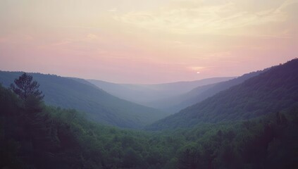 Misty mountain valley at sunset