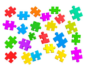 Colorful jigsaw puzzle pieces scattered on black background