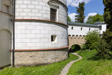 Park near Royal Tower and entance gate to Krasiczyn Castle, Poland