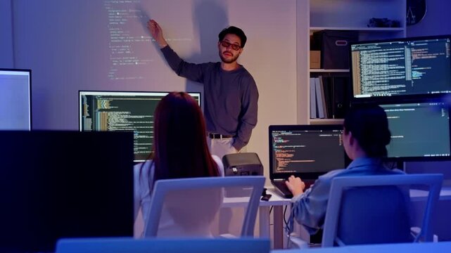 Asian software engineer or programmer team working late in development office,problem solving or algorithm of ai assistant helping for work.software developer,digital technology security concept