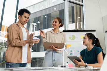 ESG Initiatives in Action. Diverse team members discussing sustainability and business strategies.