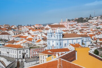 Obraz premium Panoramic View of Angra do Heroismo Townscape. Stunning high-angle view of the historic town with its characteristic red-tiled roofs, colorful buildings, including the Igreja da Misericordia, Terceira