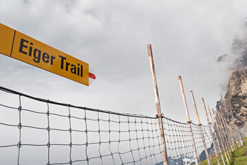 Eiger trail signpost and safety net, Bernese Oberland, Switzerland