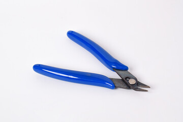 Wire and cable cutting pliers with blue plastic handles, isolated on white background