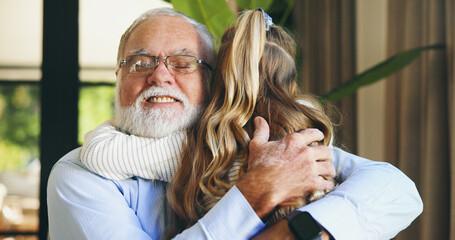 Hug, grandchild and grandpa with smile, home and love for granddaughter in living room, family and...