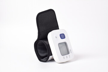 Digital wrist blood pressure monitor isolated on white background. Health care and check up concept