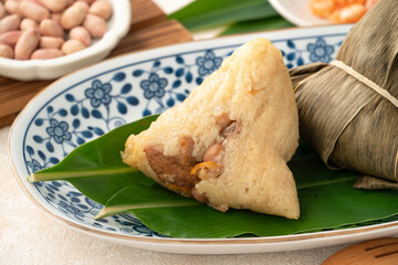 Zongzi, rice dumpling for Dragon Boat Festival on white table background.