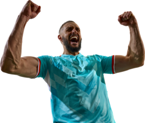 Intense portrait of young football player in blue uniform shouting in celebration holding fists raised against transparent background. Concept of sport energy, championship, final victory, tournament