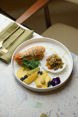 Lobster with roasted vegetables and lemon slices