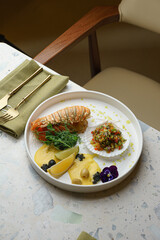Top view of gourmet lobster dish on white table