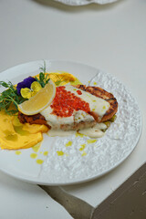 Gourmet seafood plate on white marble table