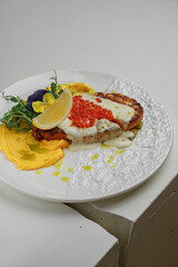 Lobster and potatoes served on fine porcelain