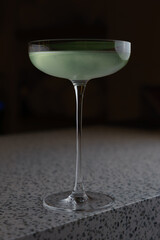 Green Cocktail in Dark Moody Lighting