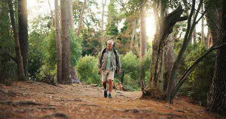 Outdoor, walking and senior man on hike, journey and adventure in nature, traveller and retirement....