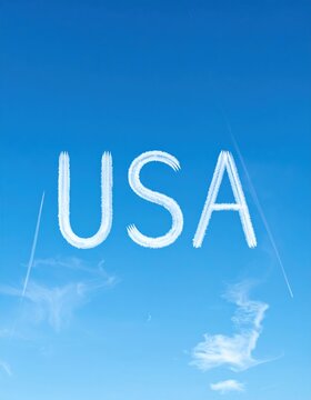 Usa skywriting with clear blue sky and clouds