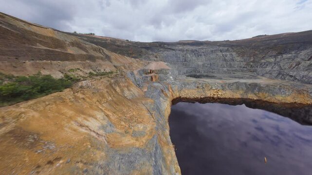 Contentious open pit mining operation of Barrick Pueblo Viejo. FPV drone view