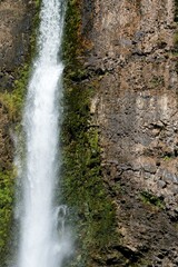 Close-up view of Hunua Falls cascading over rocky cliff