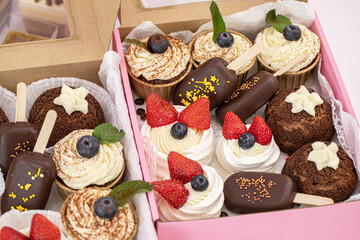 Homemade sweets made from natural and healthy ingredients. Festive background with mini cakes. Delicious cake