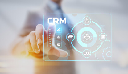 CRM Customer relationship management concept. Businessman pressing button on screen.