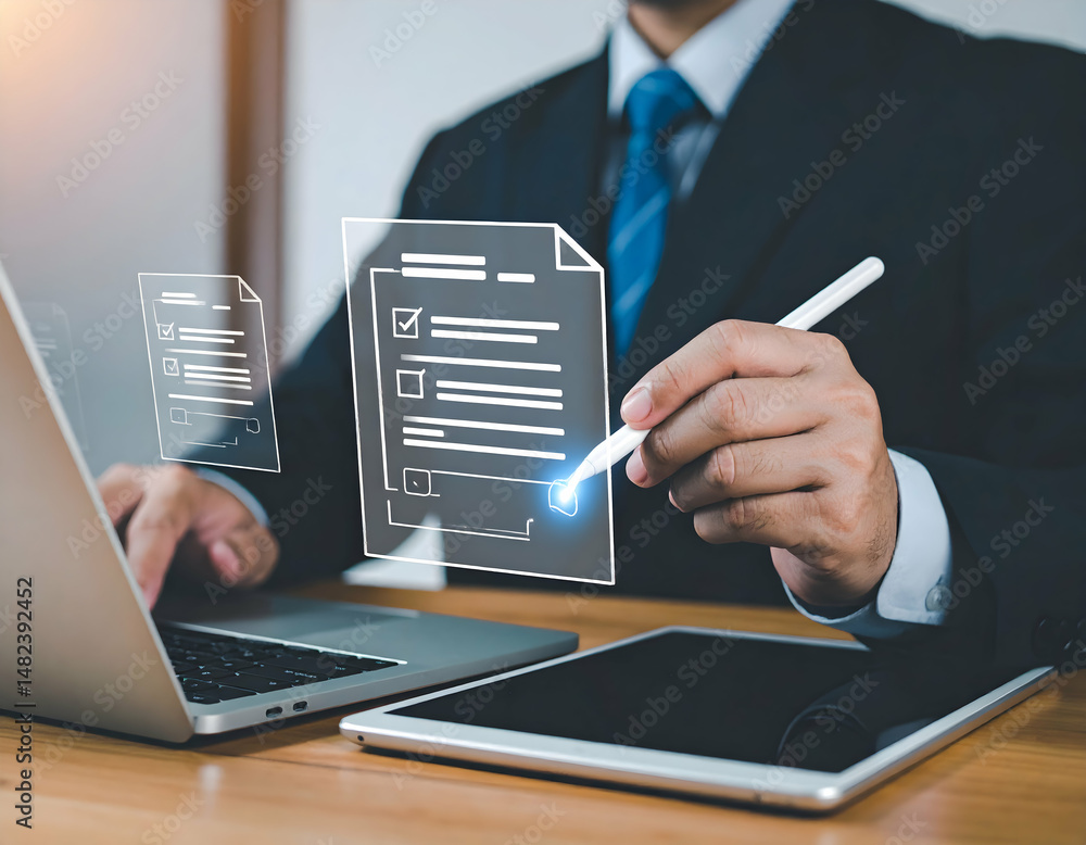 Poster man digitally signs documents using a stylus on a tablet and laptop