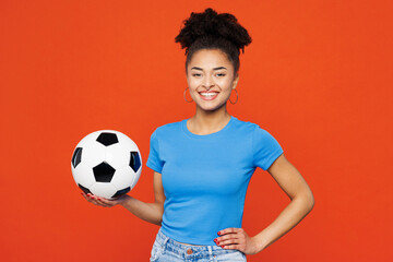 Young smiling happy cheerful woman fan wears basic blue t-shirt cheer up support football sport...