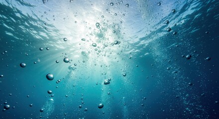 Bubbles Rising Through Clear Blue Water with Sunlight Filtering from Above