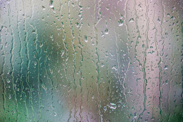 Rain on a window pane in closeup